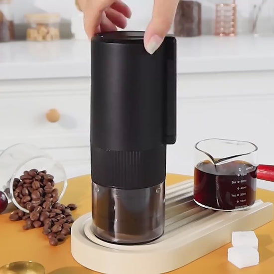 Portable coffee grinder with compact cordless design for fresh coffee at home office or travel video
