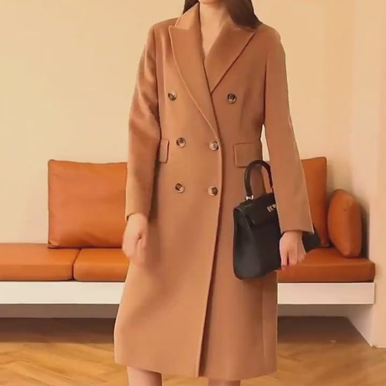 Double breasted long coat with lapel collar and tailored fit for women model shot video