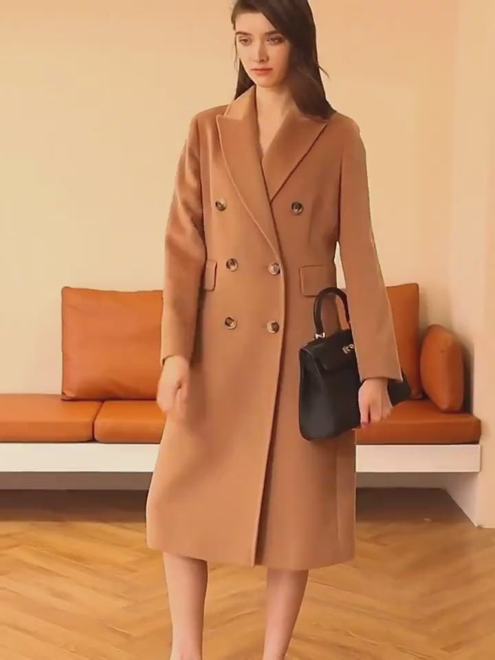 Double breasted long coat with lapel collar and tailored fit for women model shot video