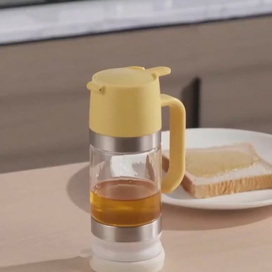 Easy pour honey dispenser with smooth controlled flow and anti drip design for clean serving video