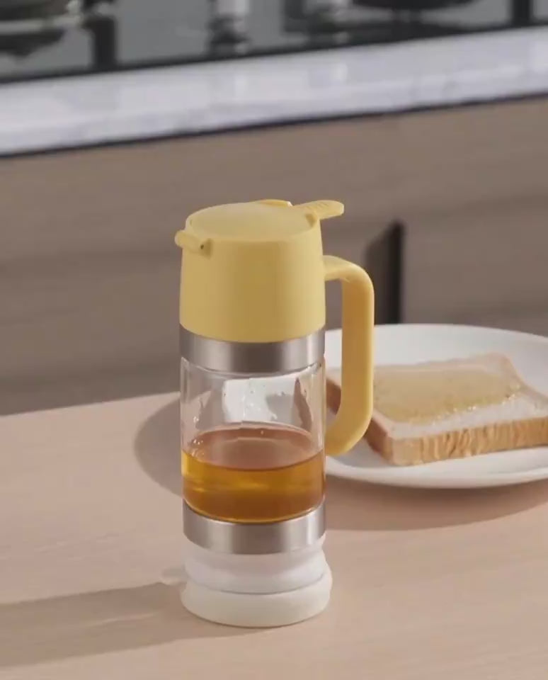Easy pour honey dispenser with smooth controlled flow and anti drip design for clean serving video