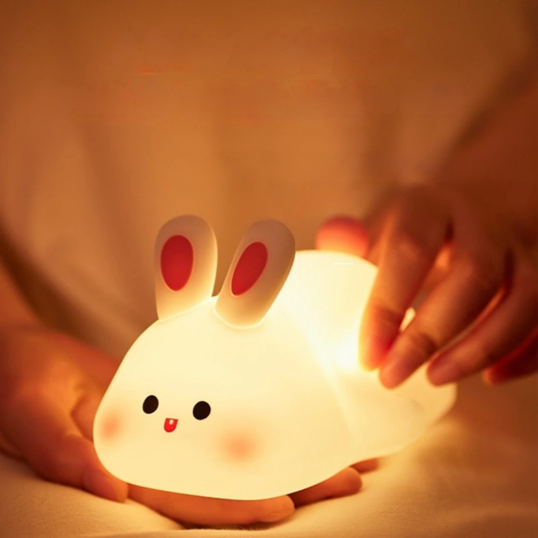 Rabbit night light with soft glow and dimmable settings for kids bedroom and nursery depiction of pinching