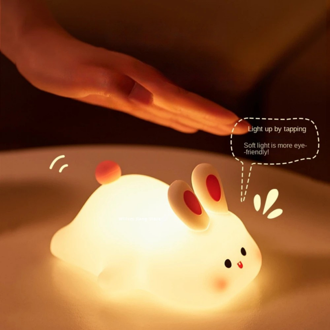 Rabbit night light with soft glow and dimmable settings for kids bedroom and nursery depiction of tapping
