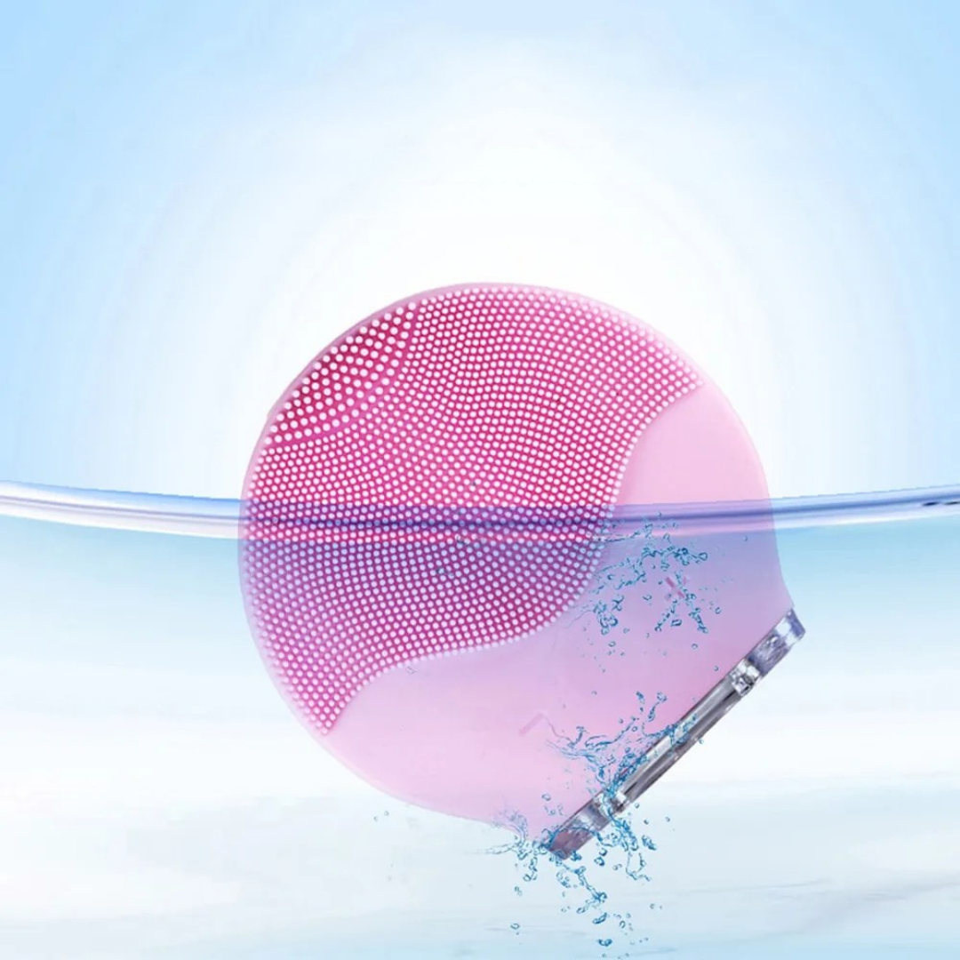 Rechargeable silicone face cleanser device for deep facial cleansing and gentle skin massage depiction of waterproof feature
