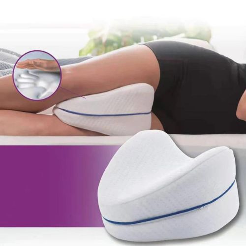 Side sleeper knee pillow with ergonomic memory foam support for leg and hip alignment during sleep