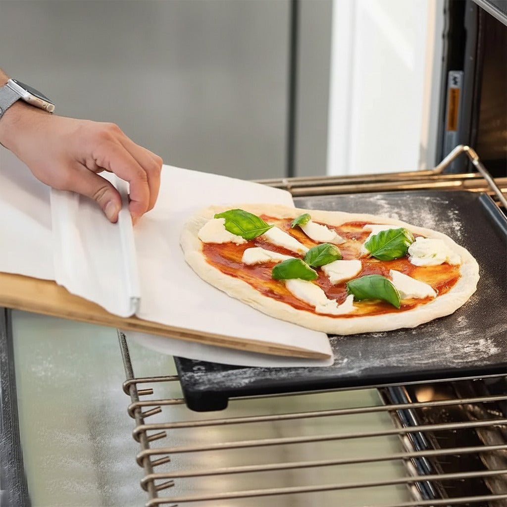 Sliding pizza dough transfer board for easily moving raw dough and flour-coated pizza bases to the oven
