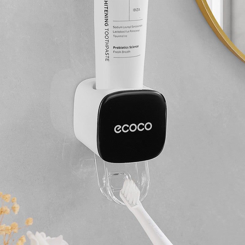 Wall-mounted automatic toothpaste dispenser in black color designed for hands-free and hygienic toothpaste dispensing in bathrooms (Color: Black)