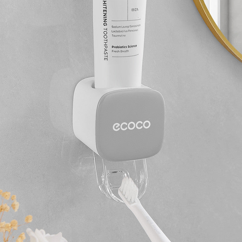 Wall-mounted automatic toothpaste dispenser in gray color designed for hands-free and hygienic toothpaste dispensing in bathrooms (Color: Gray)