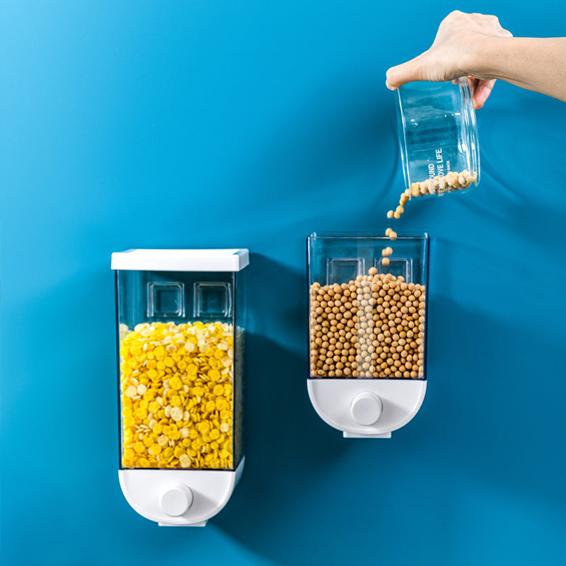 Wall-mounted cereal and dry food storage dispenser with easy press design for convenient kitchen organization depiction of filling the container