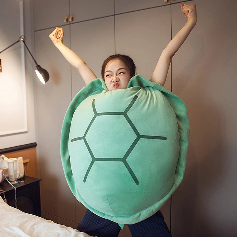 Wearable turtle shell pillow with soft plush filling for cozy lounging and playful comfort model shot