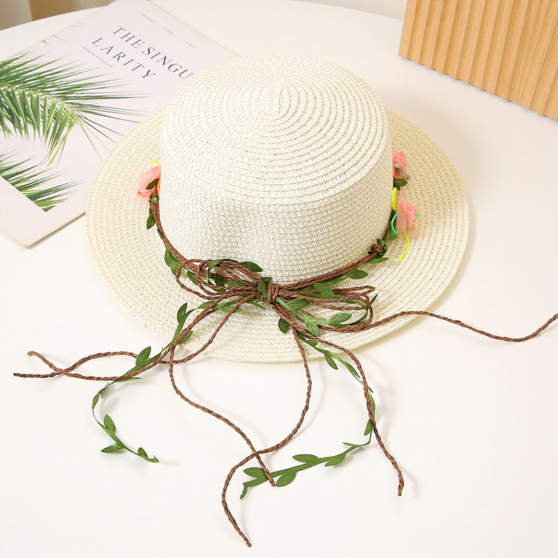 Women’s flat top straw sun hat with wide brim in white color and breathable design for beach and summer wear (Color: White)