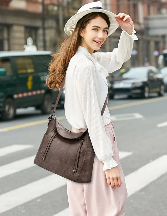 Women’s large capacity shoulder bag with soft leather look and multiple compartments for everyday use alternate model shot