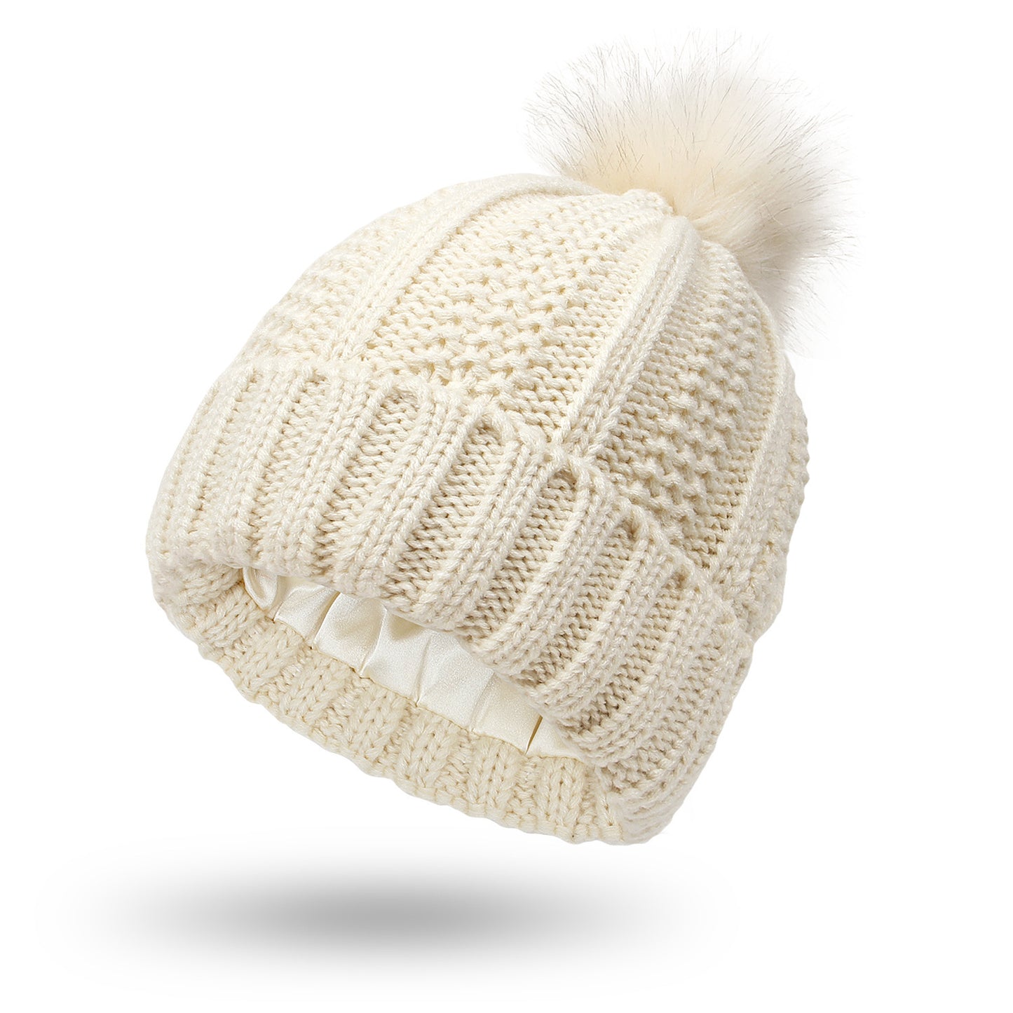 Women’s satin-lined knit beanie in beige color with faux fur pom pom designed to keep hair protected and warm in winter (Color: Beige)