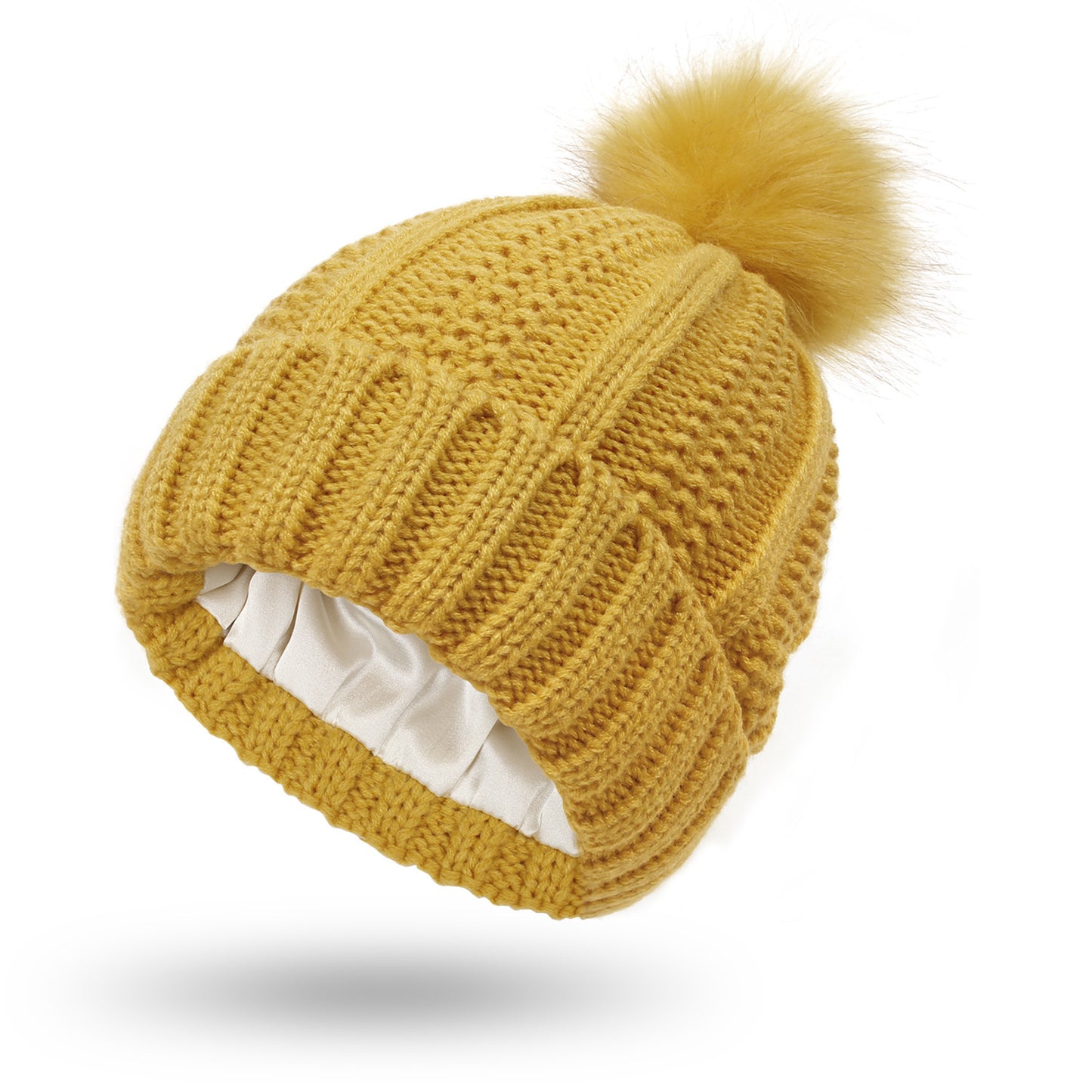 Women’s satin-lined knit beanie in yellow color with faux fur pom pom designed to keep hair protected and warm in winter (Color: Yellow)
