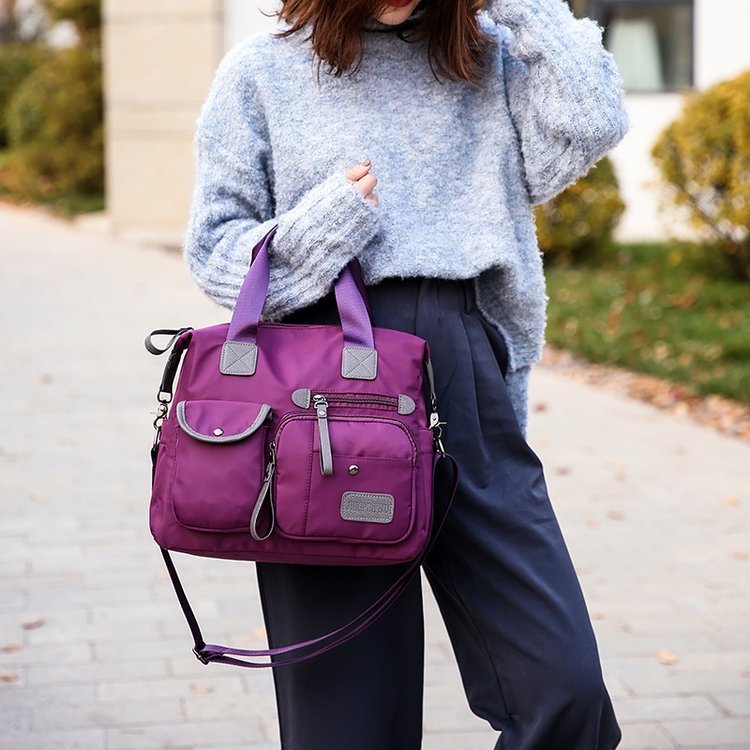 Women’s waterproof multi-pocket shoulder bag with large capacity for everyday commuting and casual use model shot front