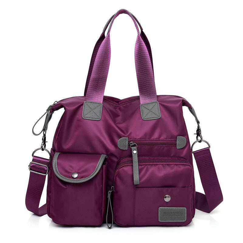 Women’s waterproof multi-pocket shoulder bag in purple color with large capacity for everyday commuting and casual use (Color: Purple)