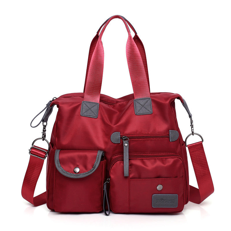 Women’s waterproof multi-pocket shoulder bag in red color with large capacity for everyday commuting and casual use (Color: Red)